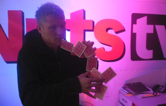 Street Magician Liam Walsh performing close up magic on Nuts TV in London